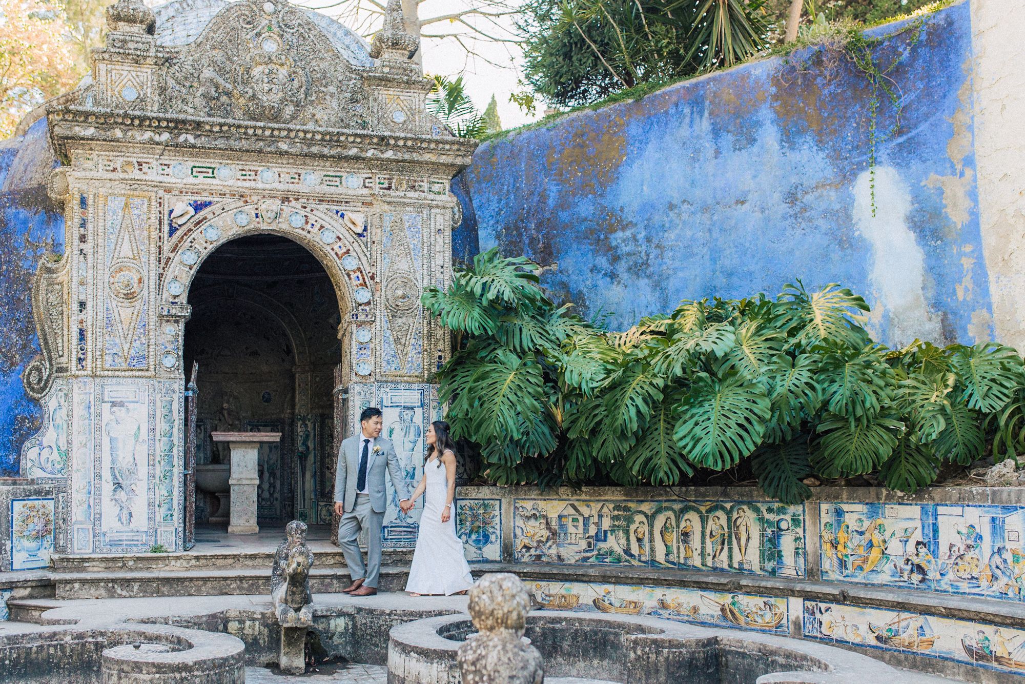 Elegant wedding couple photo against Portuguese tile walls at fonteira palace, captured by a destination wedding photographer in Portugal