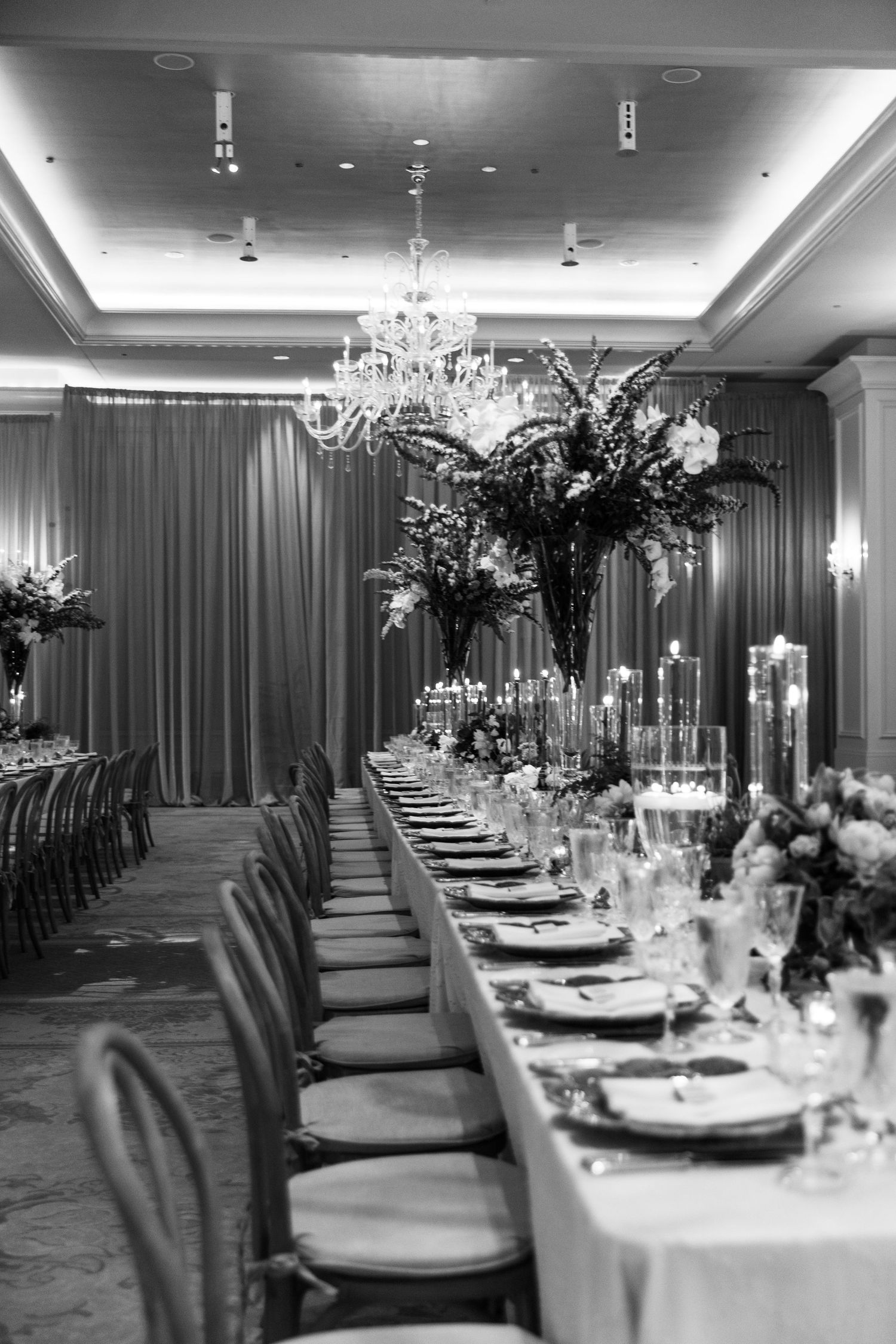 A bridal portrait in a modern setting with minimal decor, white sofa, and abstract art on the walls.