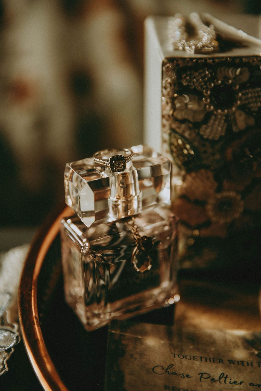 Vintage style montage showing antique glass perfume bottles and labels with elegant text in warm sepia tones.