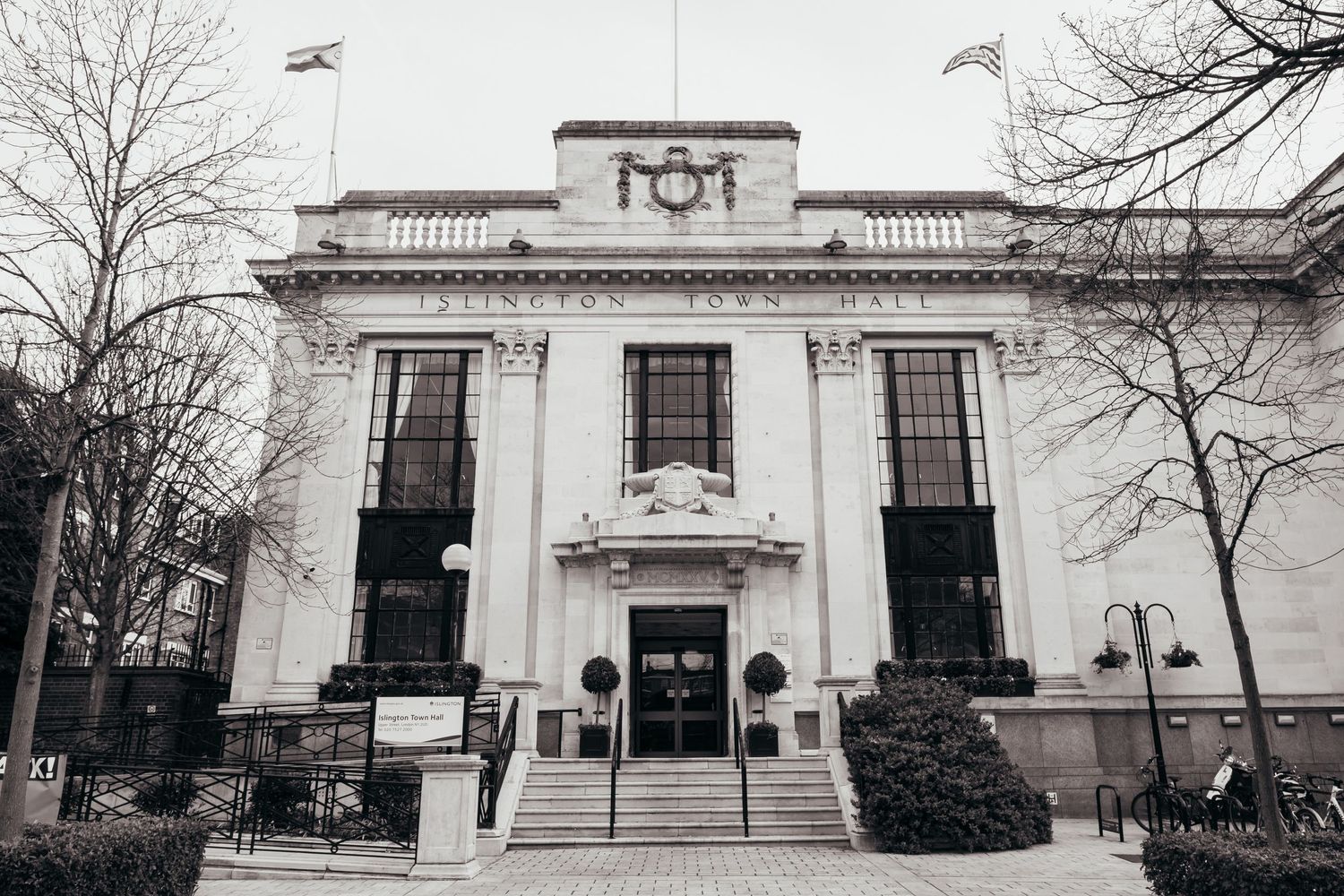 Black and white architectural photo of a grand historic building with columns and steps.