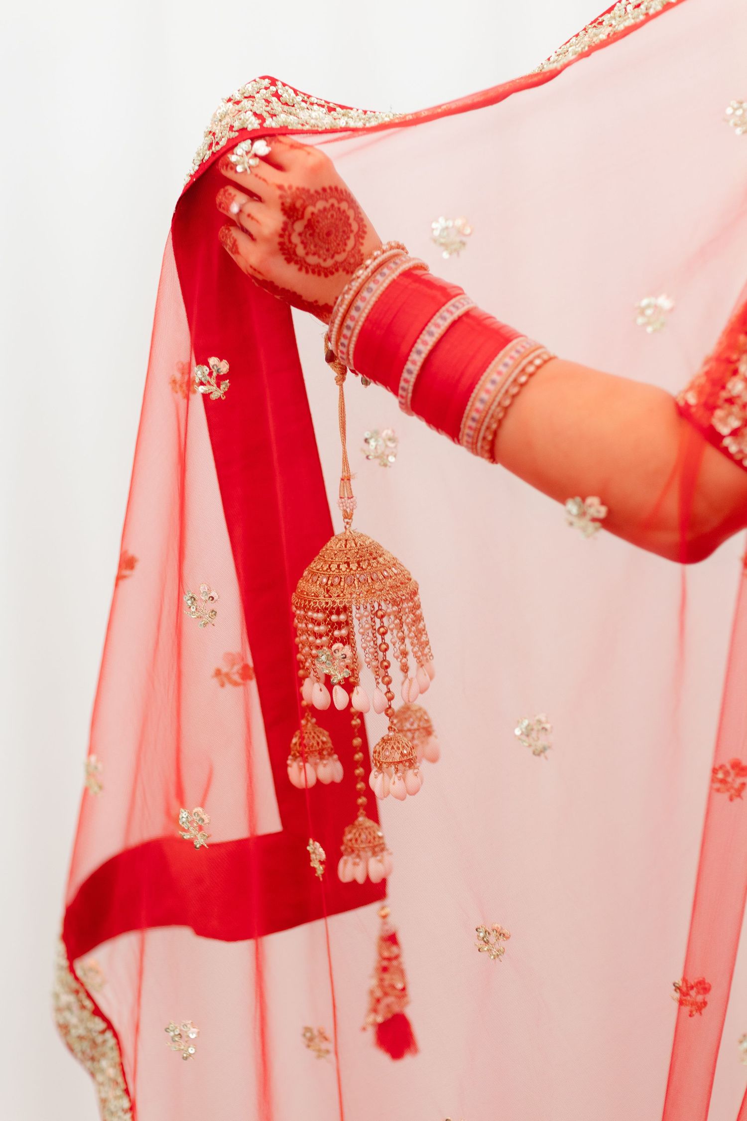 Closeup of Sikh bride's hand holding her dupata