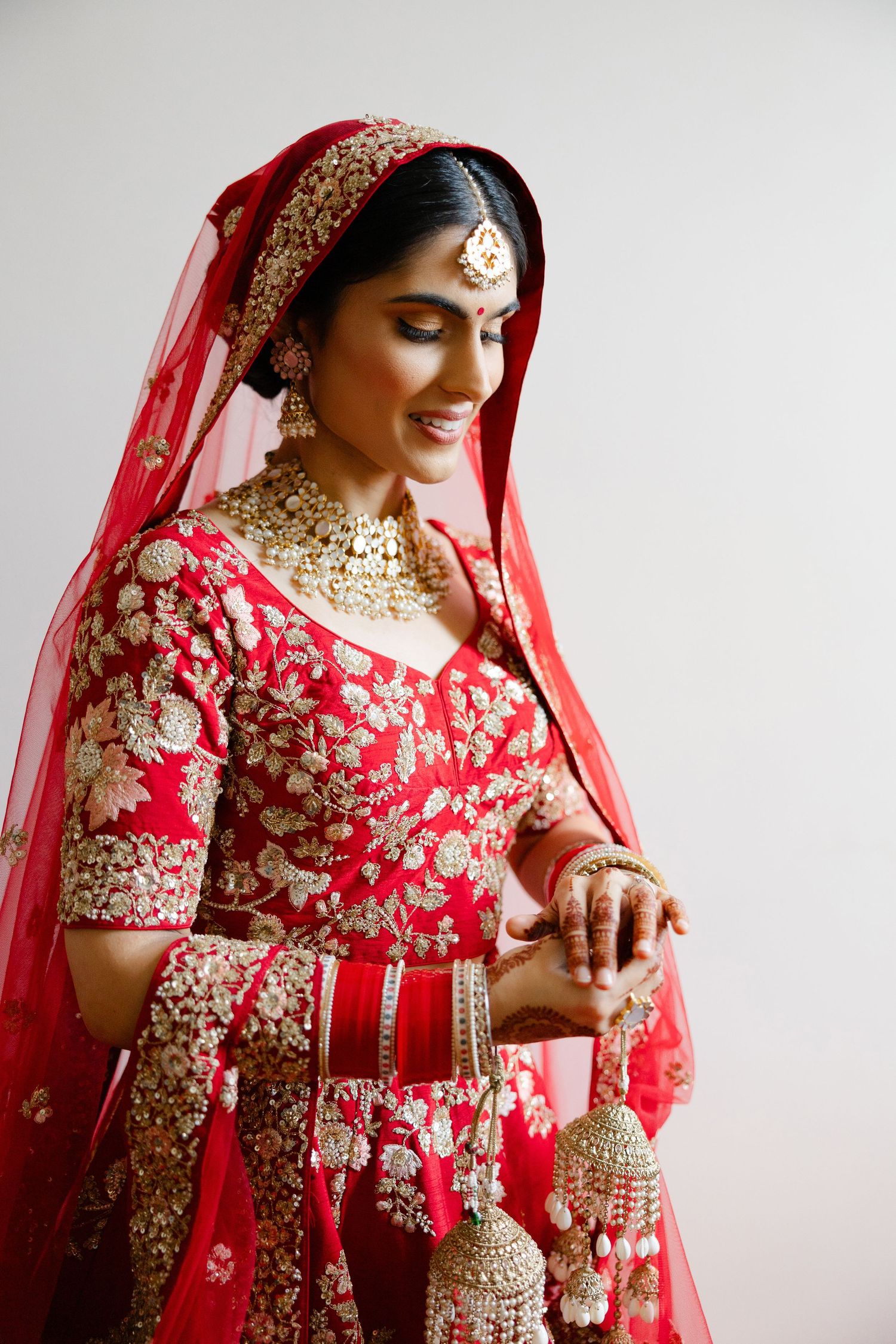 Sikh bride looking at her engagement ring