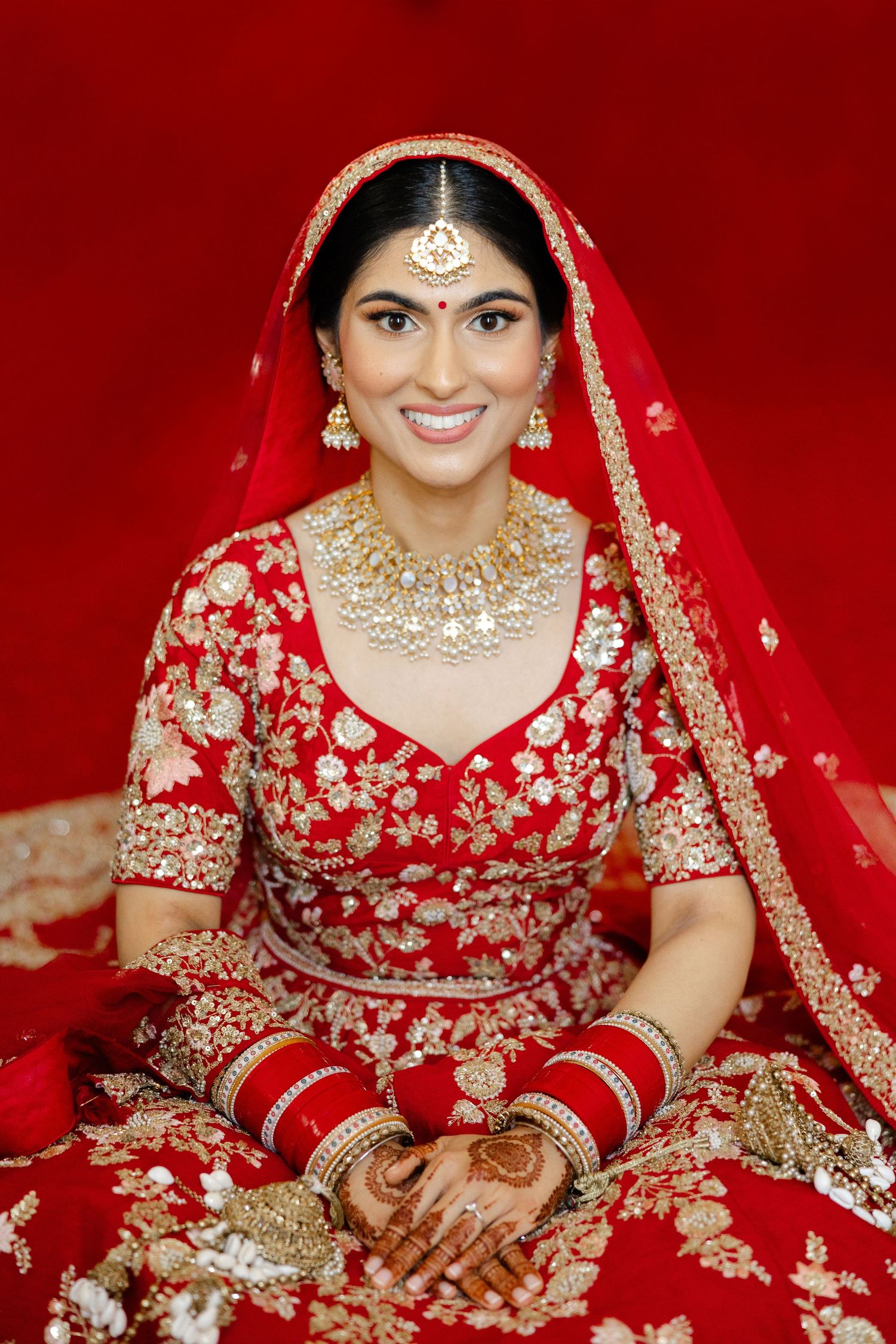 Sikh bride radiating happiness in Hounslow Gurdwara