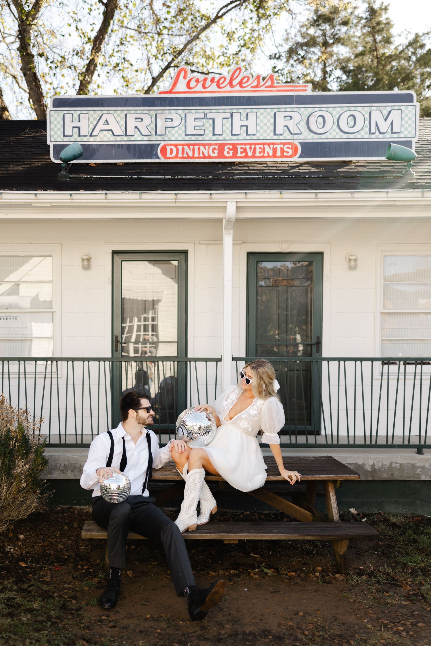 A series of romantic wedding photos captured outside a rustic restaurant with white painted walls and signage.