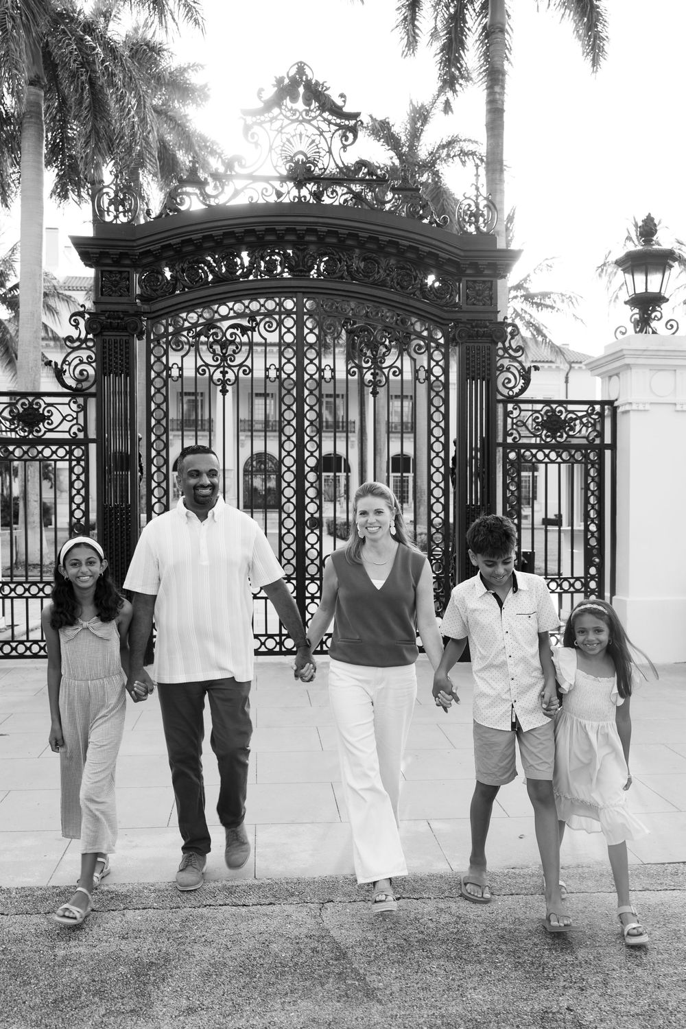 Golden hour summer family photos captured by Lindsay McDow Photography in front of Flagler Museum on Palm Beach Island