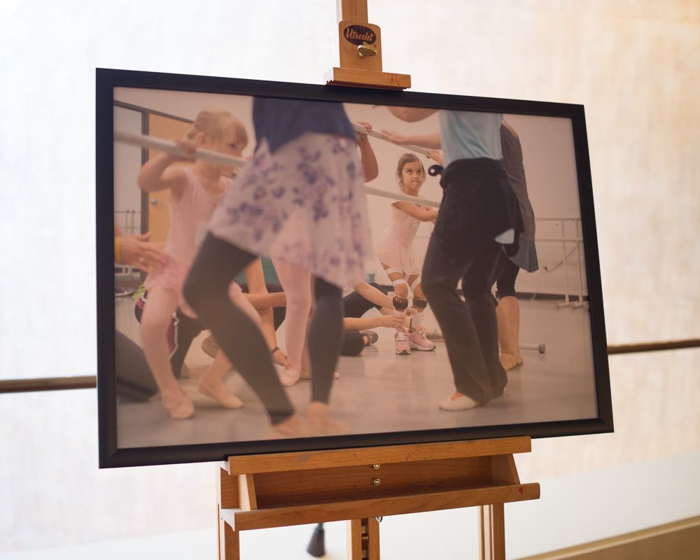 Vintage-style photograph of dancers performing in a studio setting.