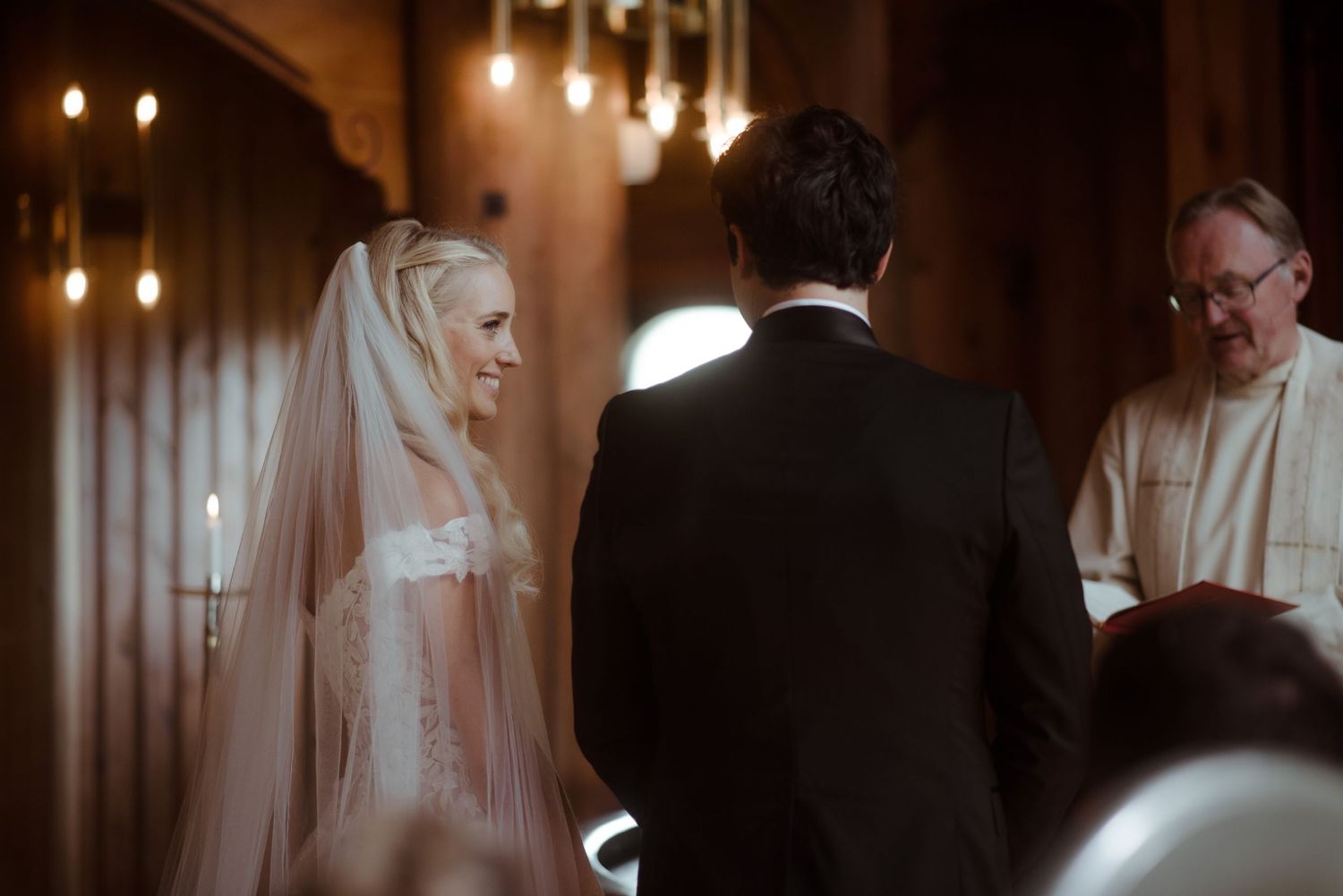 Traditional church wedding ceremony with candlelit ambiance.