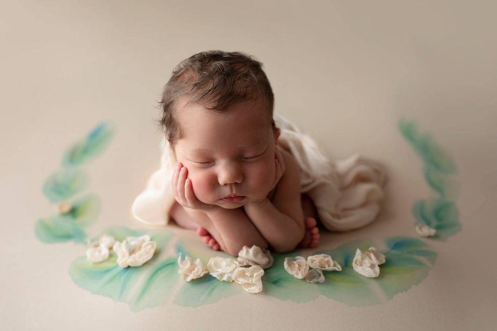 Newborn baby girl froggy pose from Elizabeth Lang Photography in Surrey.