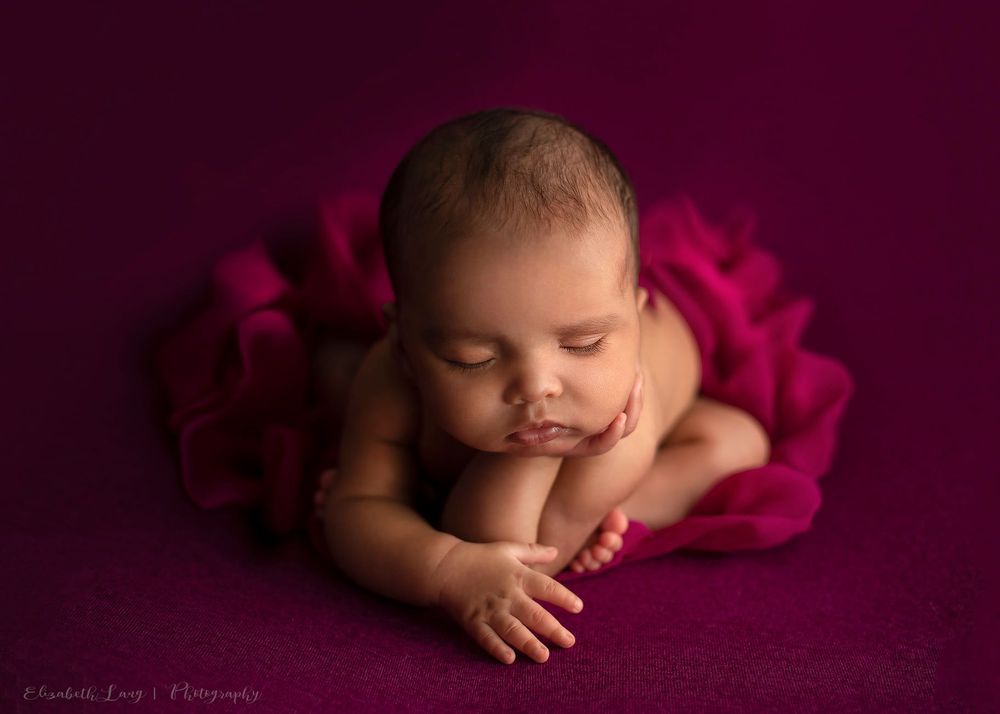Newborn baby girl froggy pose from Elizabeth Lang Photography in Surrey.