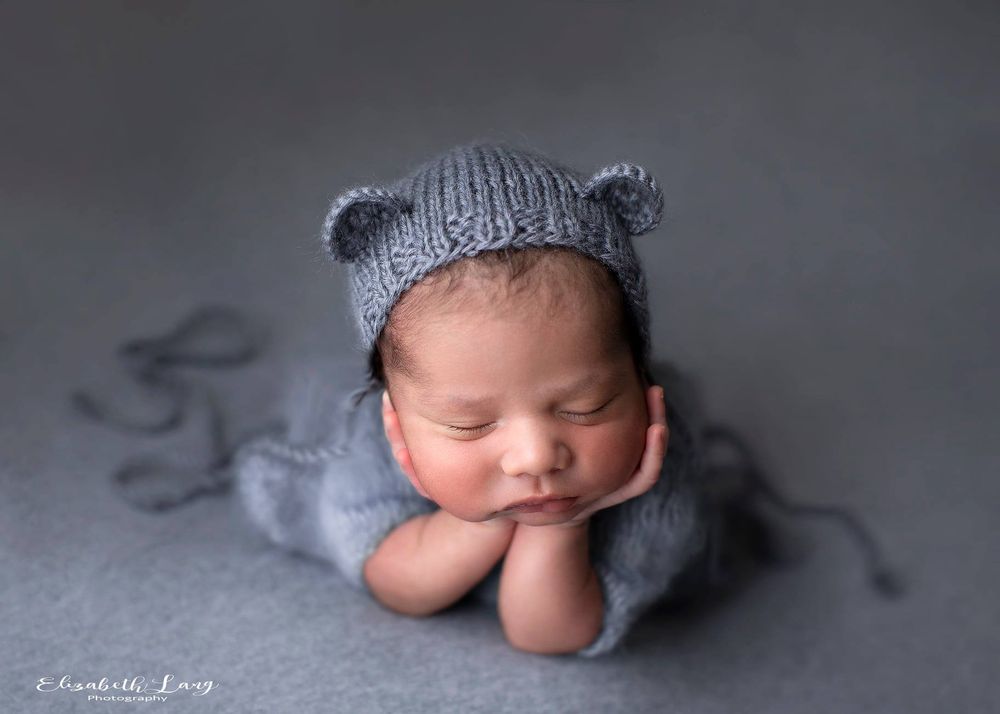 Newborn baby girl froggy pose from Elizabeth Lang Photography in Surrey.