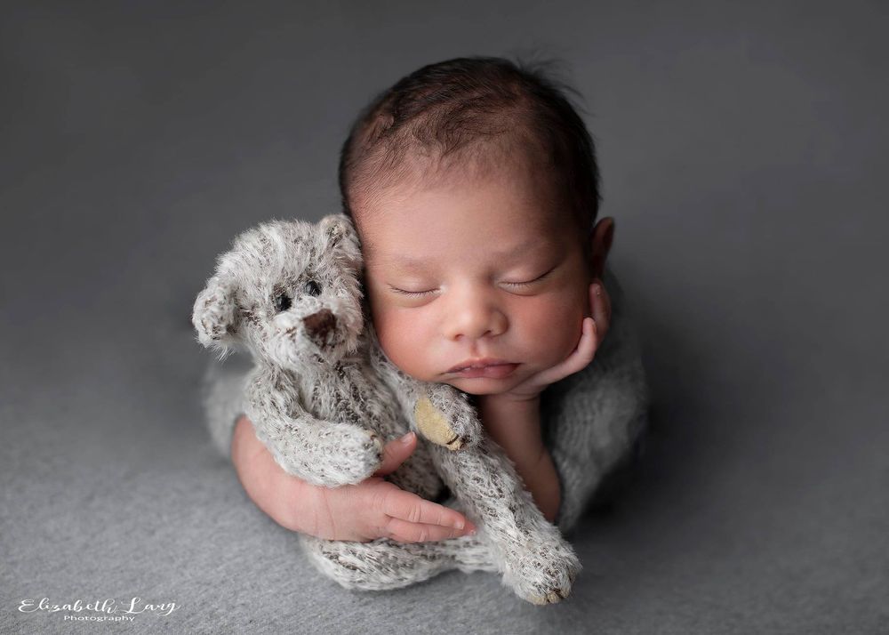 Newborn baby girl froggy pose from Elizabeth Lang Photography in Surrey.