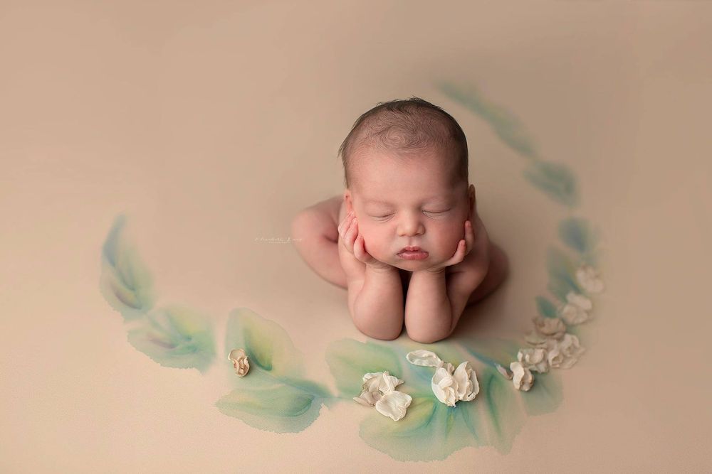 Newborn baby girl froggy pose from Elizabeth Lang Photography in Surrey.