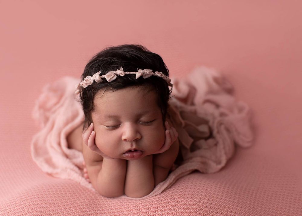Newborn baby girl froggy pose from Elizabeth Lang Photography in Surrey.