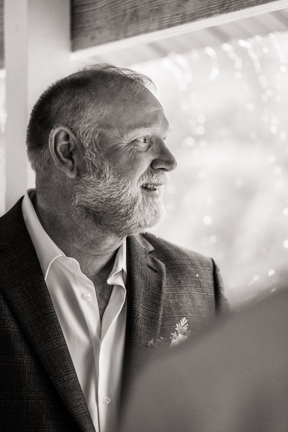 Artistic black and white profile portrait showing wedding day emotion.