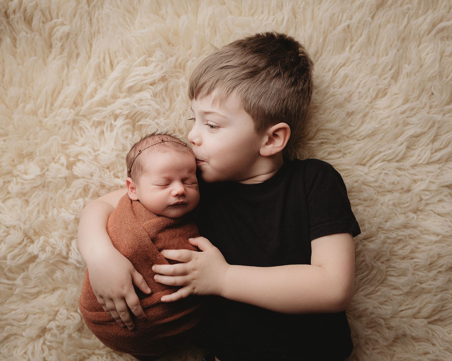 Professional photo of baby and brother
