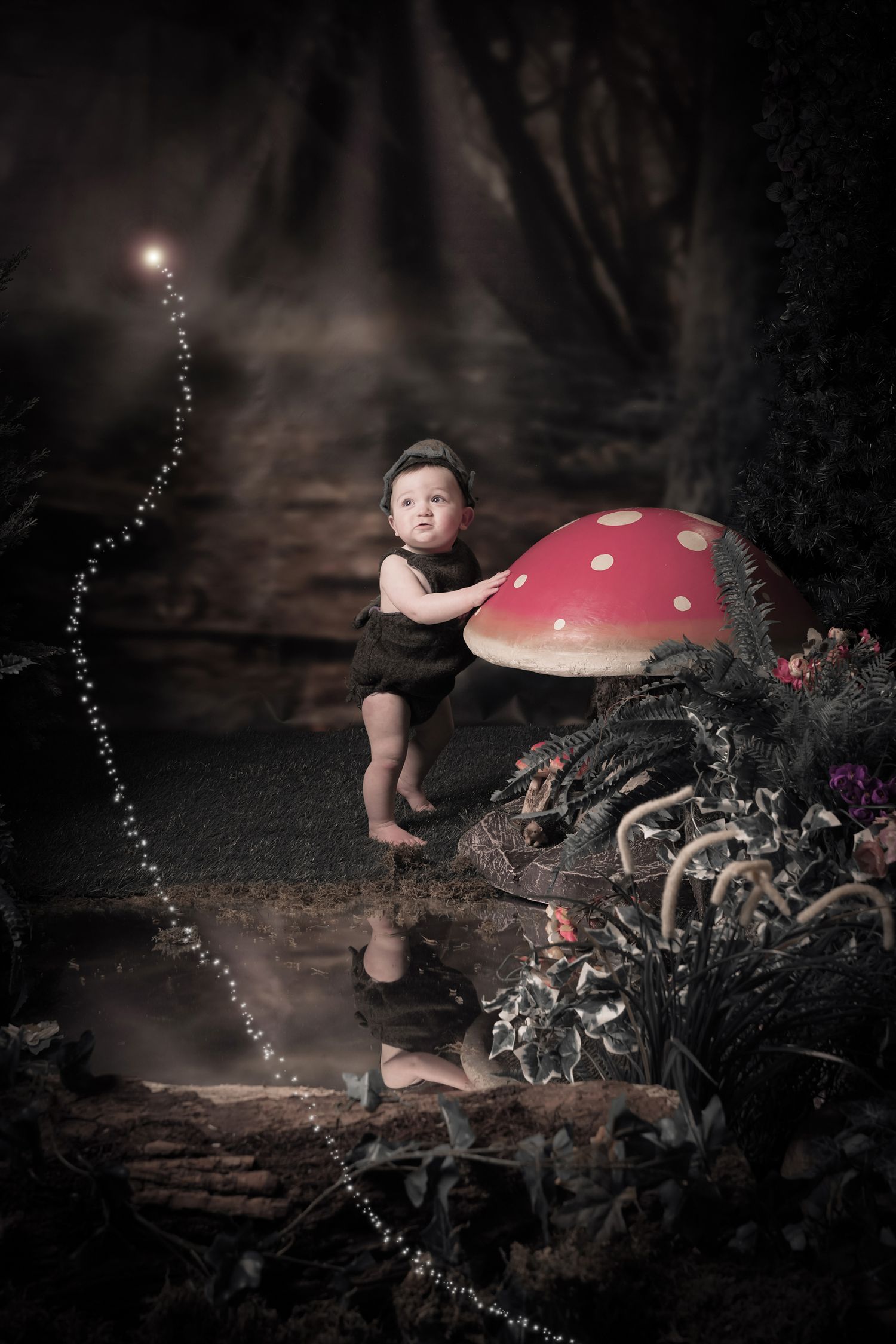 A magical forest scene with a small figure leaping near a large red spotted mushroom and twinkling lights.