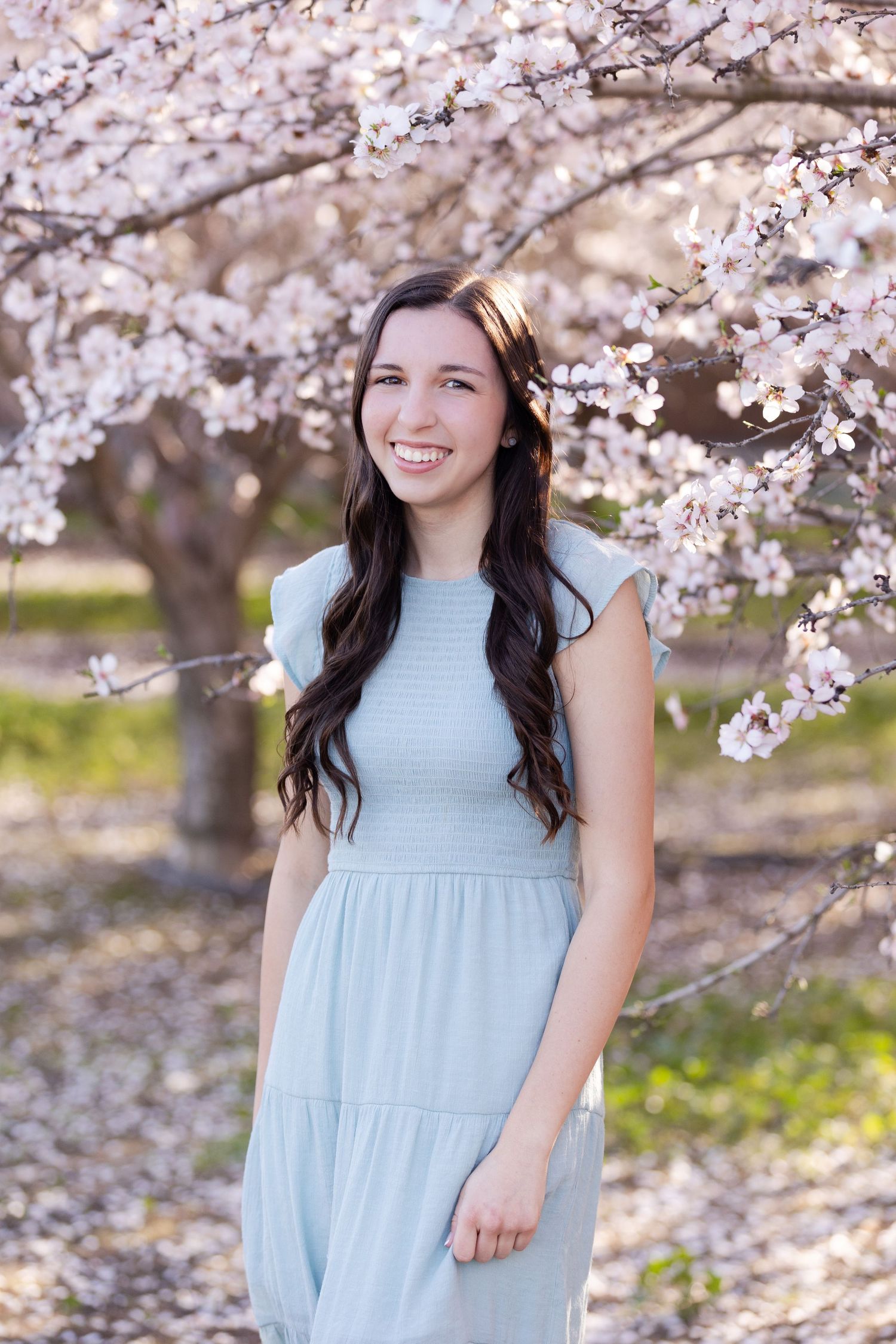 Senior Portrait in Blooming Almond Orchard in Orland, California, Northern California