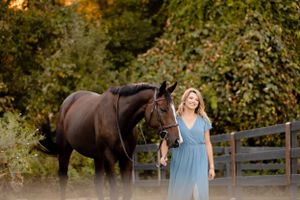 horse and rider sunset photoshoot blue gown OTTB thoroughbred green horse