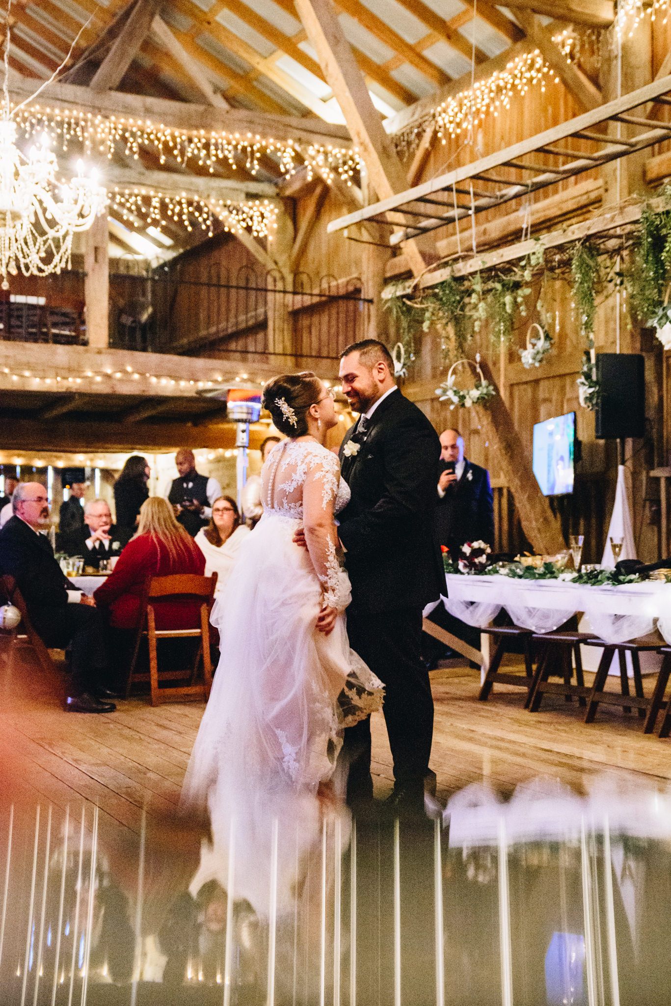 bride and groom smiling during their first dance at The Sheperd's Place in Ohio