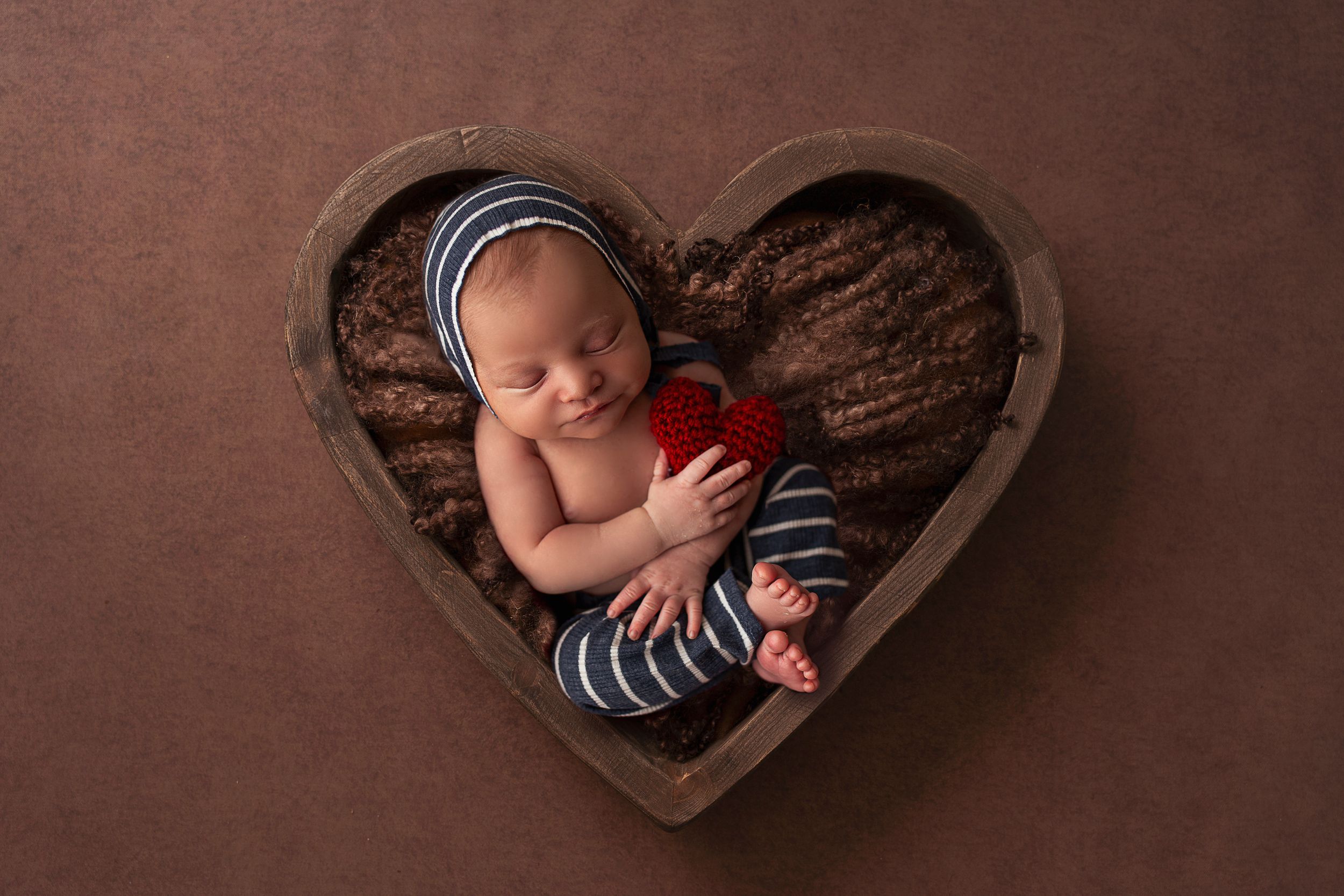 baby in heart prop newborn photographer puerto rico
