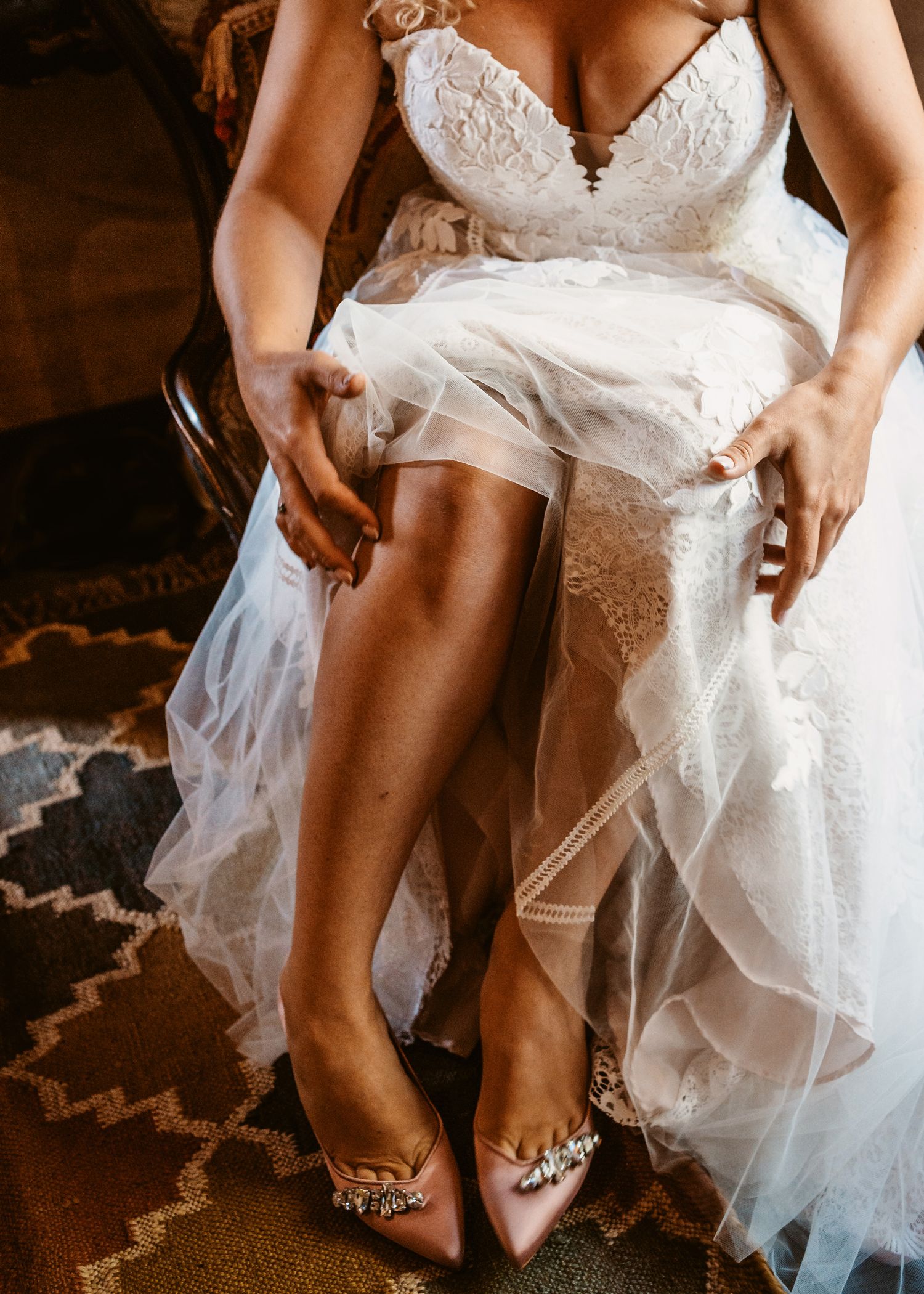 bride preparations getting her shoes on