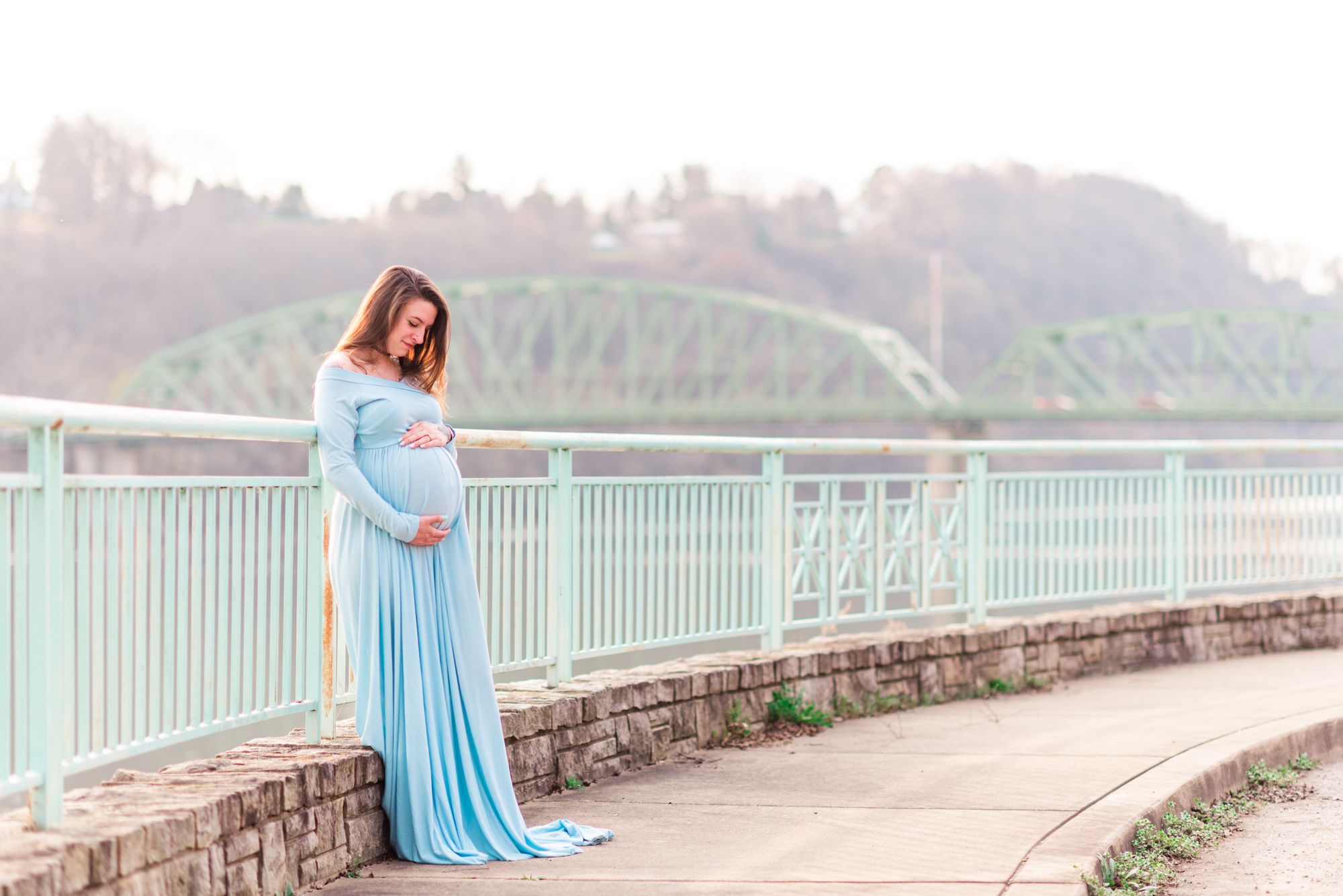 Maternity photos with flowing dress near bridge in Kittanning, Pennsylvania