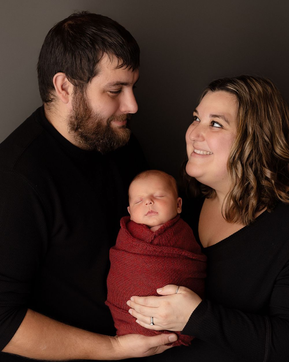 Professional newborn photo with mom and dad