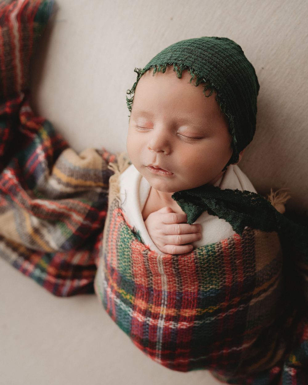 Professional newborn photo - green plaid