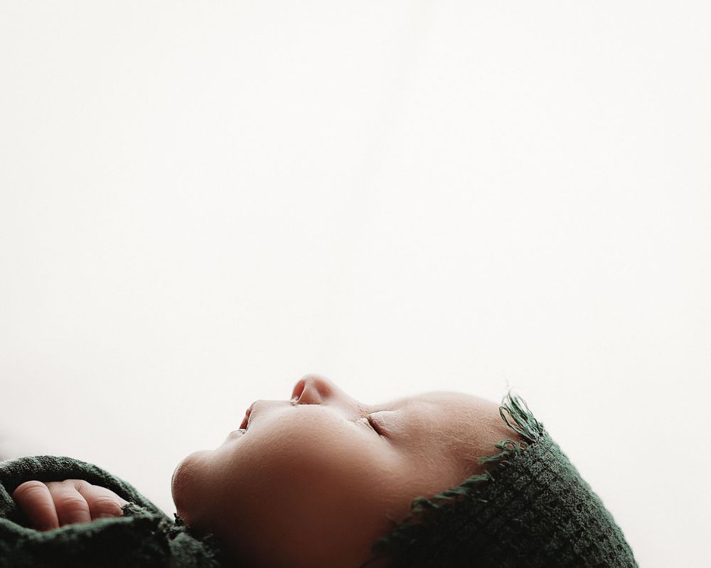 Professional newborn photo - green