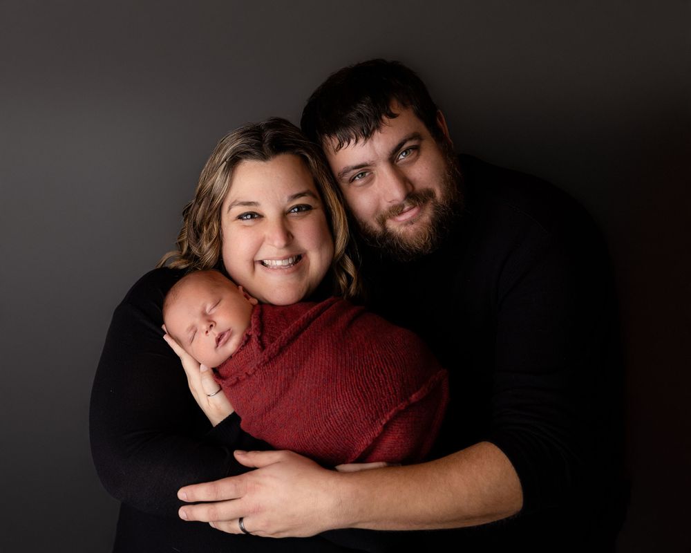 Professional newborn photo with mom and dad