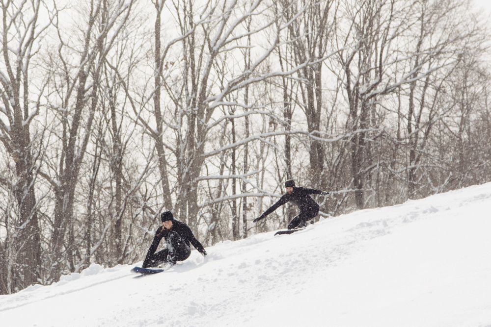 Snow surf in Japan, surfboards on snow down a mountain