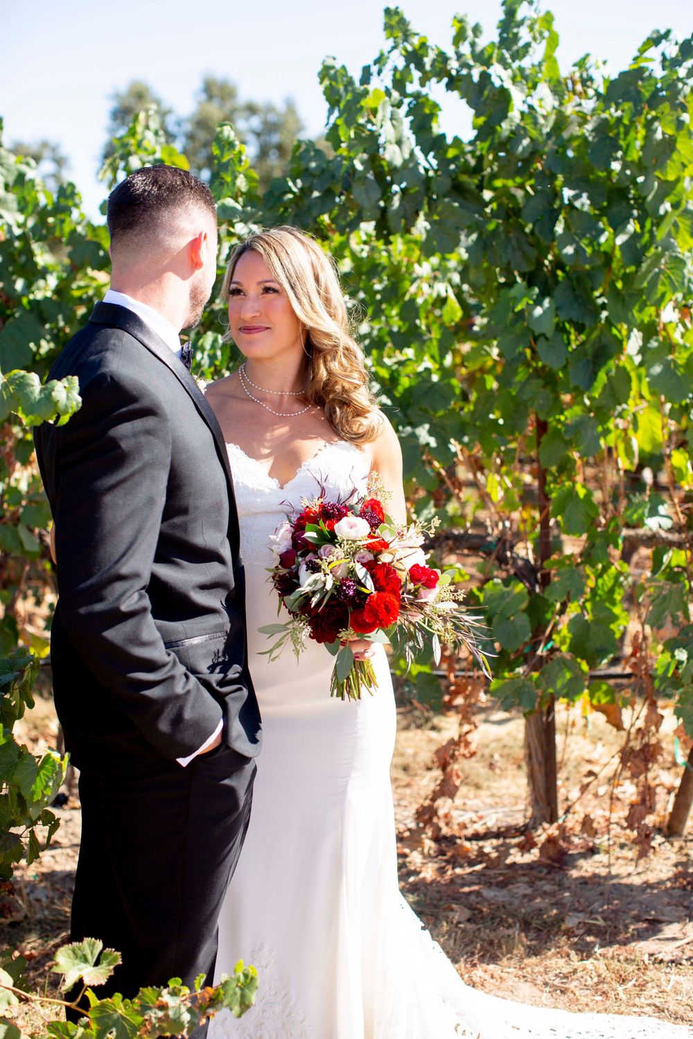 Bride and groom in vineyard at Rava Winery