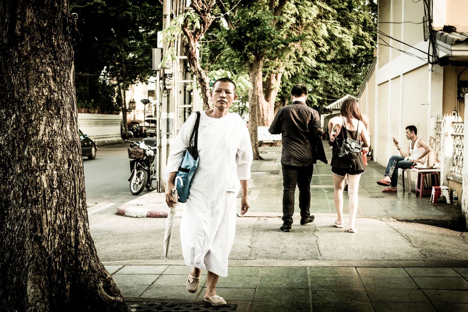 Female monk walking in the streets of Bangkok Thailand