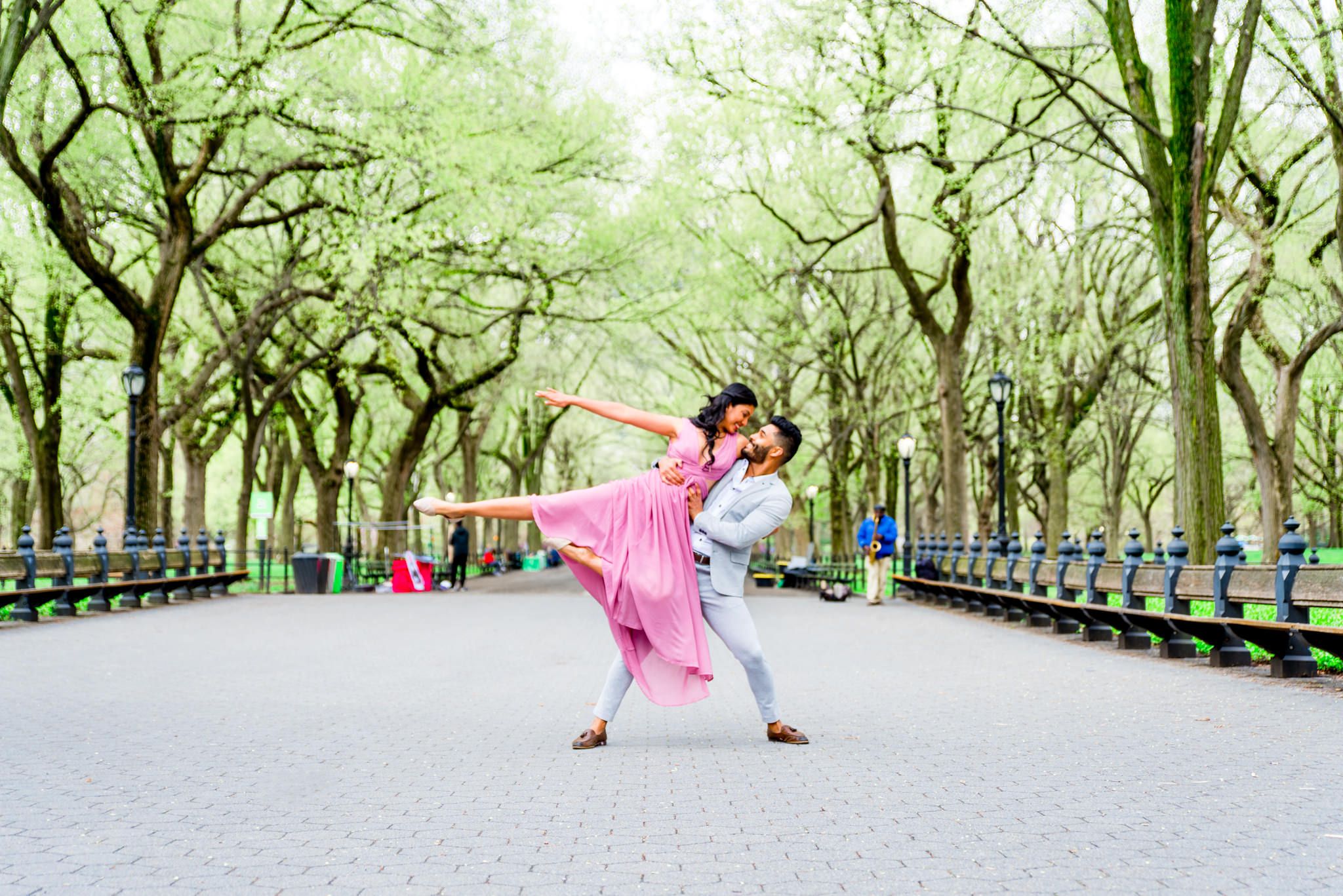 Two dancers doing a lift at The Mall for Central Park Spring engagement photos