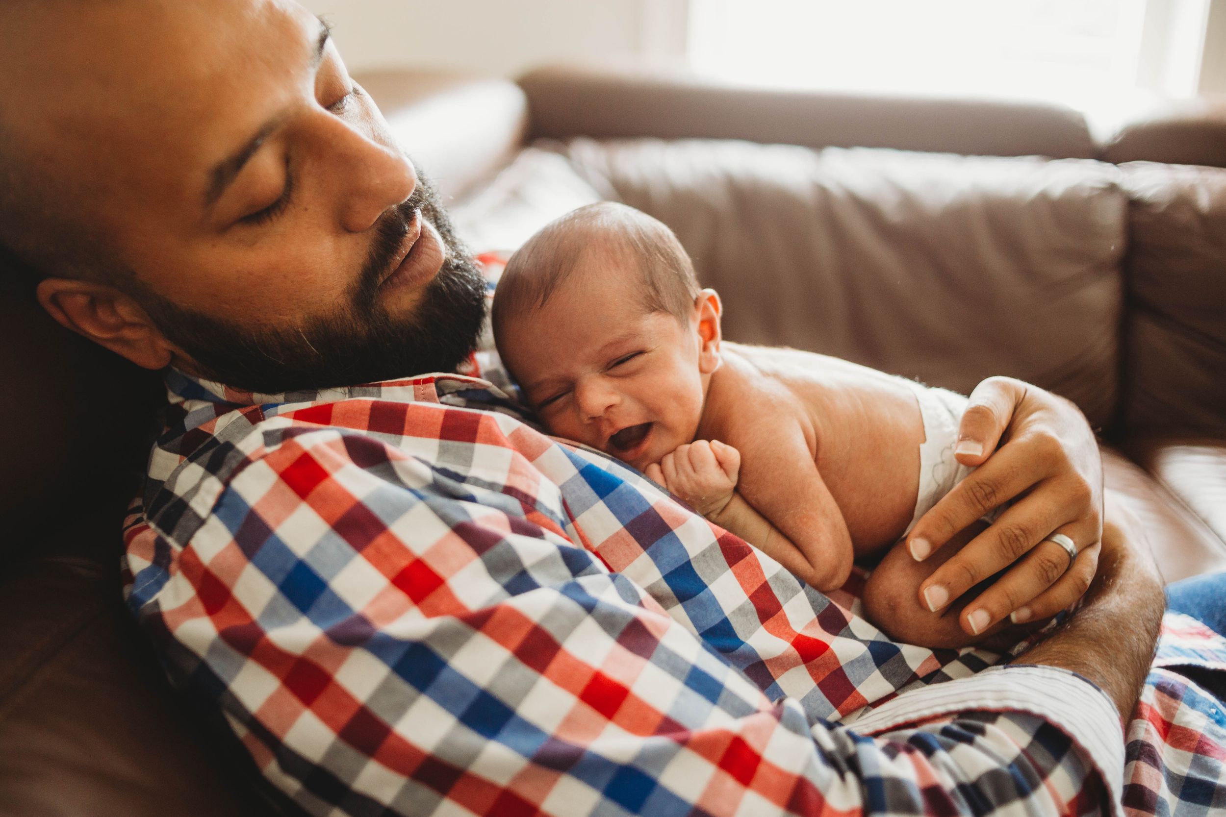 newborn snuggling on daddy by leominster photographer
