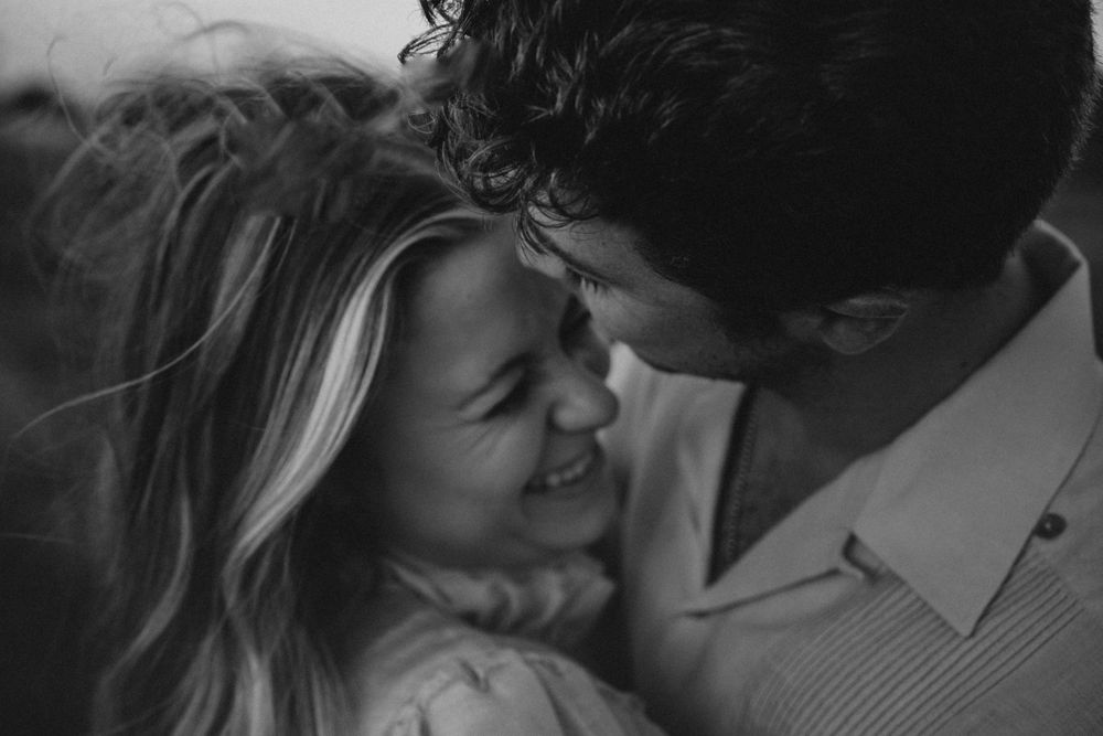 Couple in black and white cuddled up