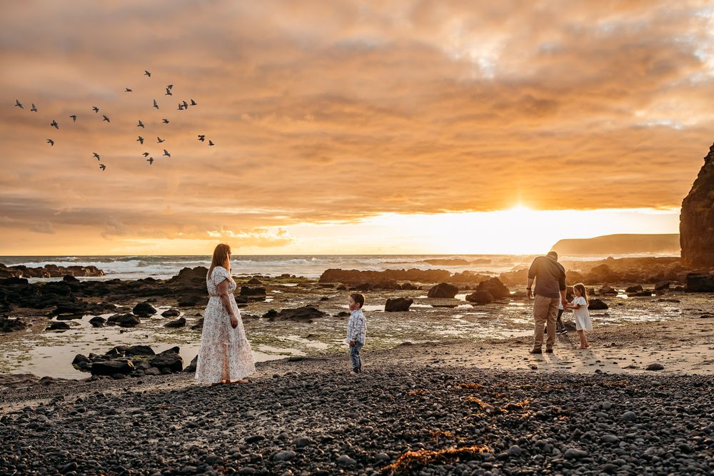 sunset at beach during family session in tasmania by joss jensen photography