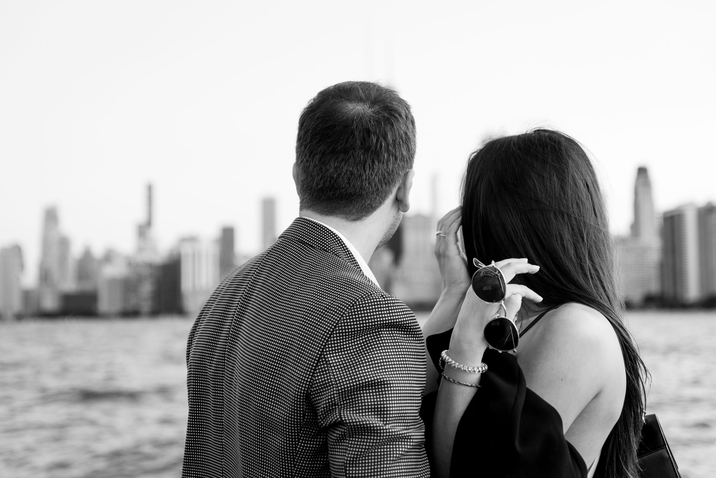 man and woman hugging after Chicago proposal at North Avenue Beach pier