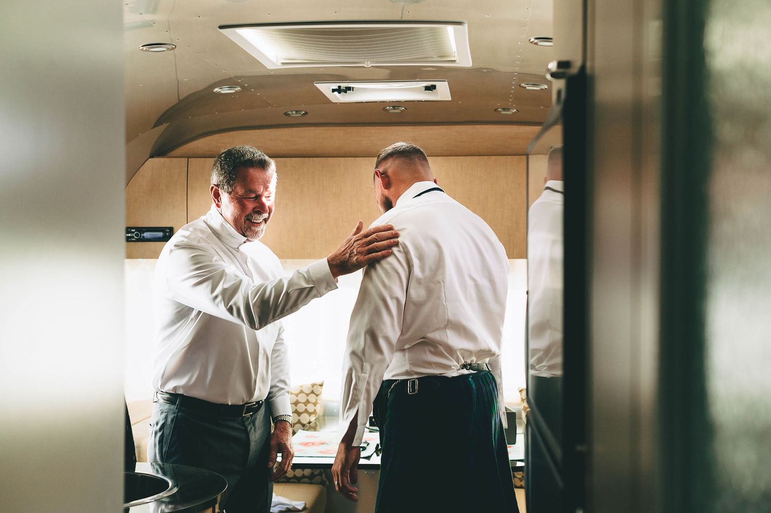 dad patting groom on the back