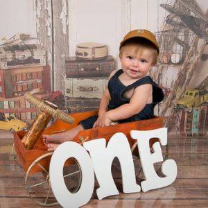 1st birthday of a little boy in an orange vintage truck-cake smash