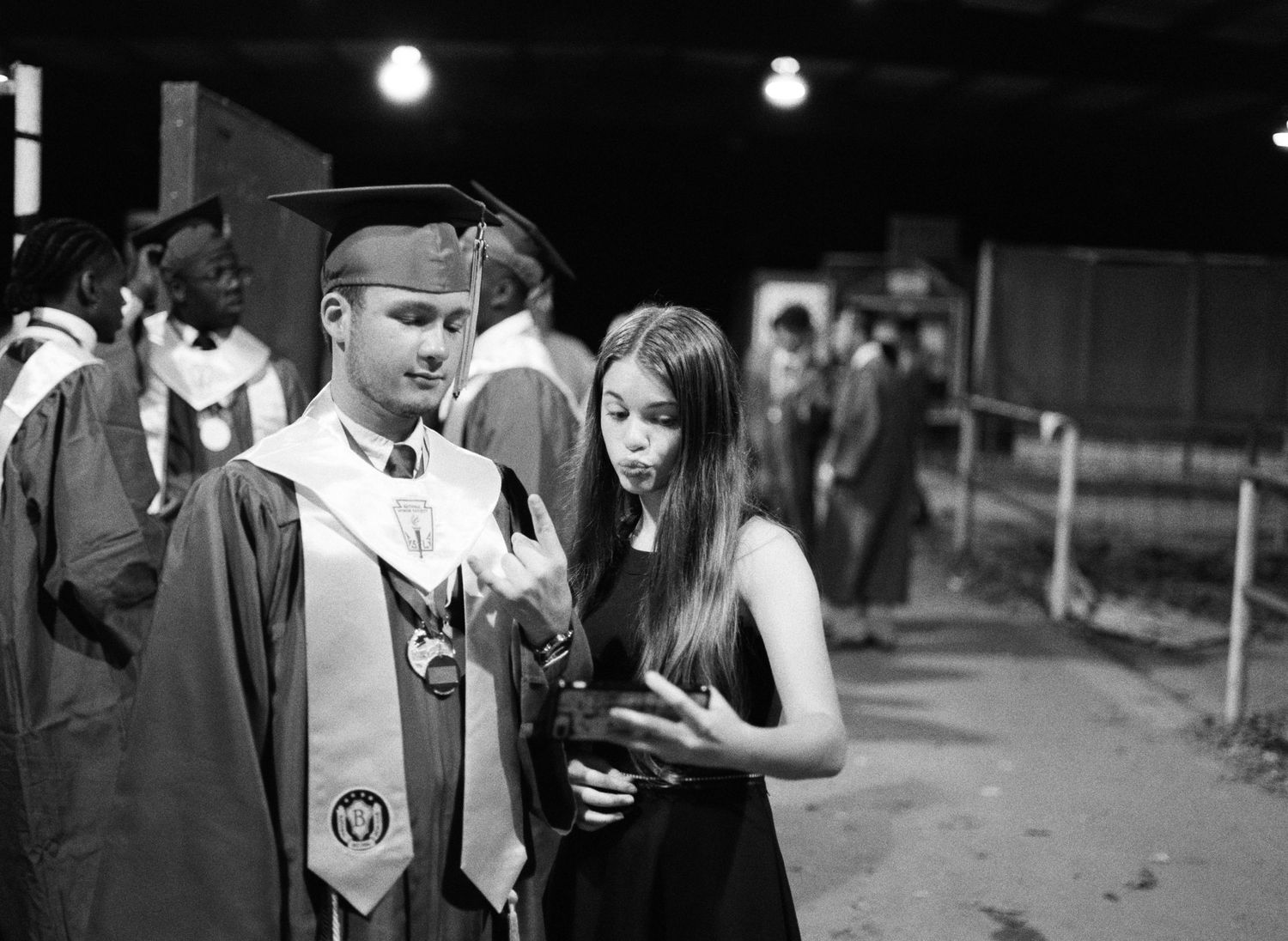 A senior in the class of 2020 at Franklinton High School and his sister after his graduation.