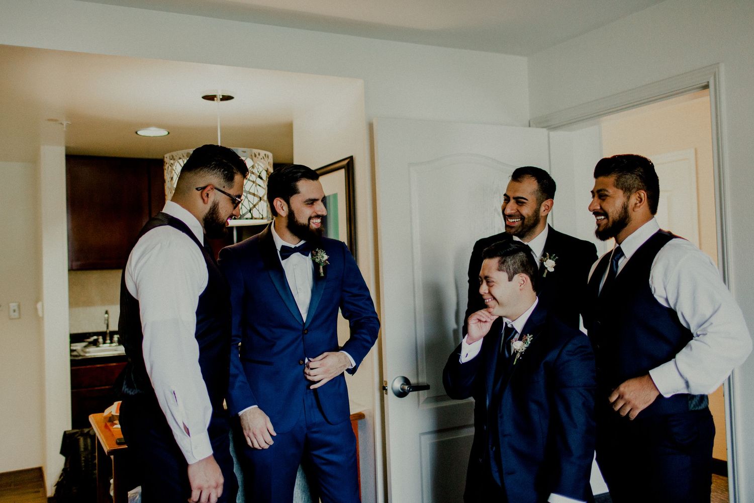 candid of groomsmen talking