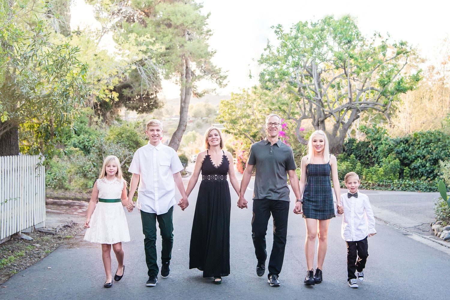 Photo of a family walking down a street in San Juan Capistrano, CA