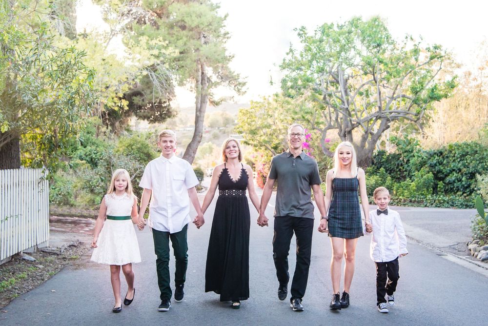 Photo of a family walking down a street in San Juan Capistrano, CA