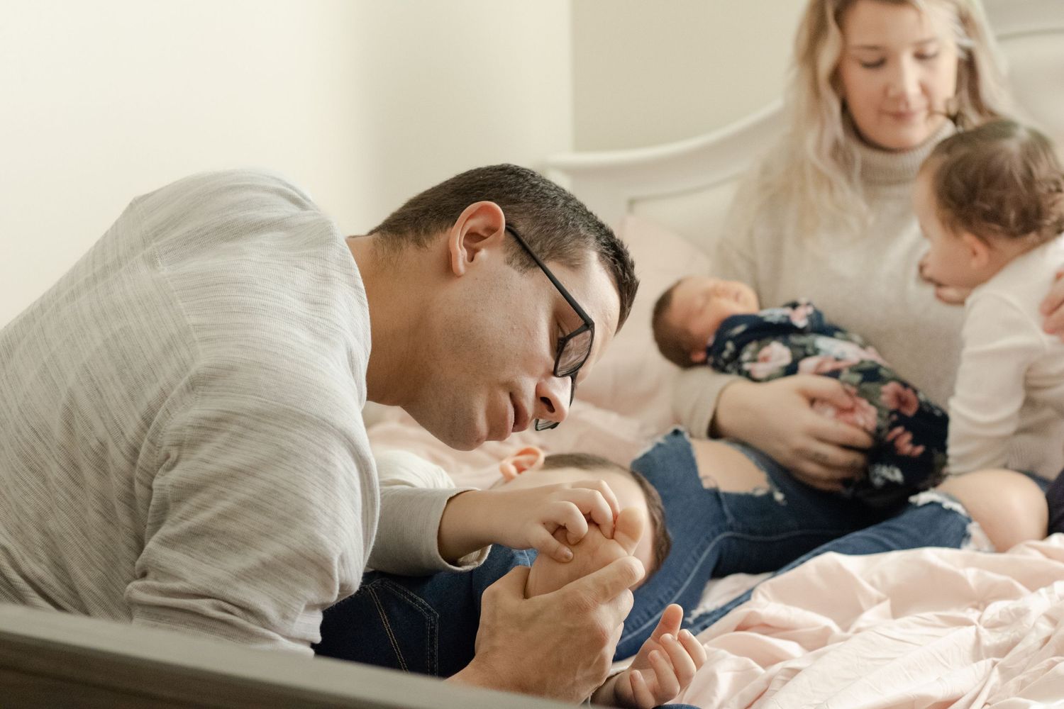 Dad checking on his son with a stubbed toe