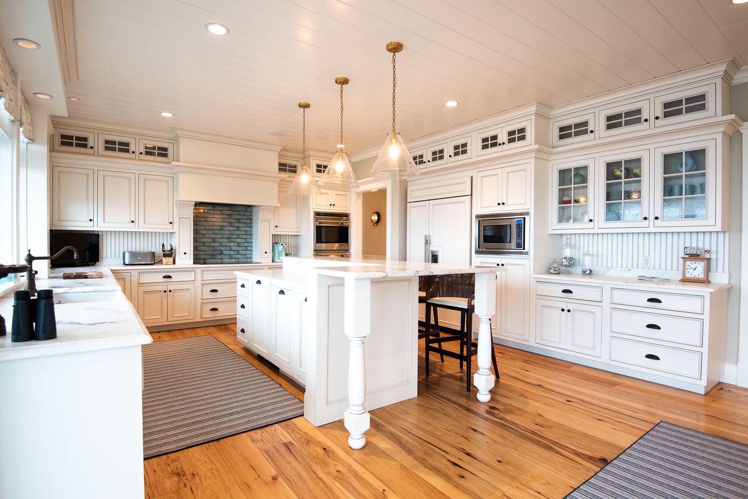 Real Estate Photograph of a beautiful kitchen with white cabinets
