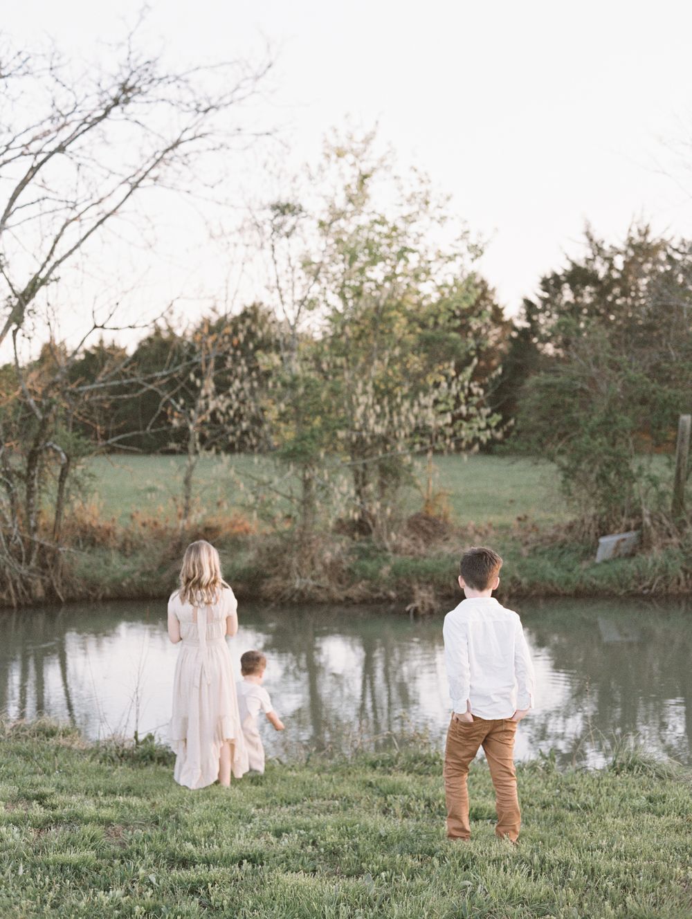 young children play at the creek