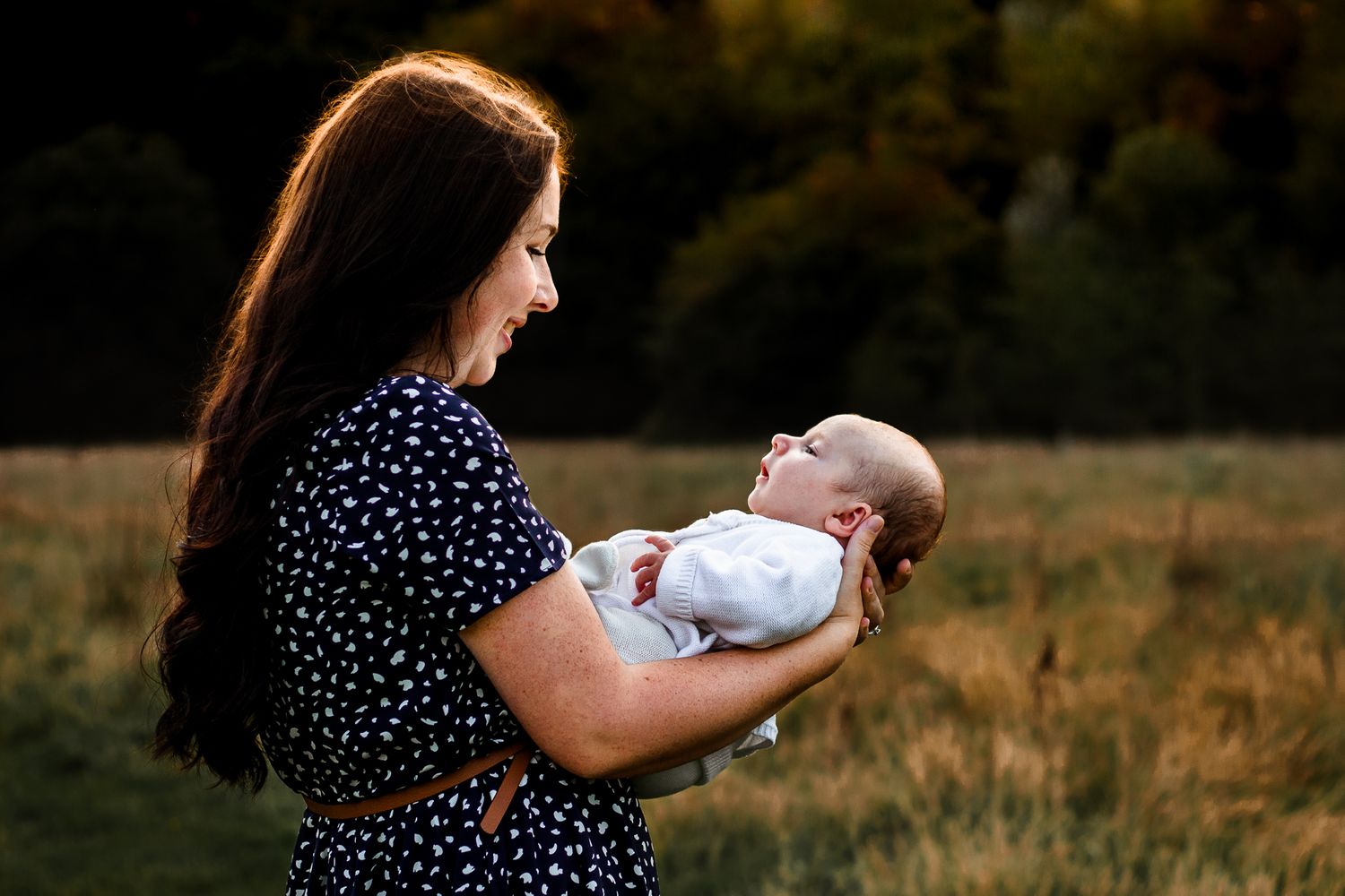 In a field in Havant, Hampshire, a new mum holds her newborn baby boy.