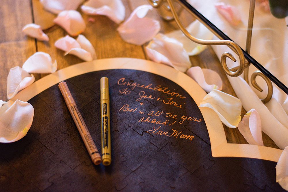 guest book heart shaped sign with pens
