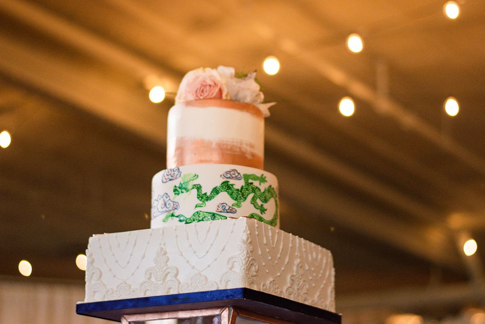 asian themed wedding cake in white, blue, green and gold
